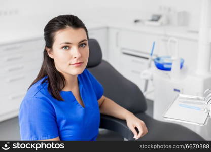 dentistry, medicine and healthcare concept - female dentist or nurse at dental clinic office. female dentist or nurse at dental clinic office. female dentist or nurse at dental clinic office