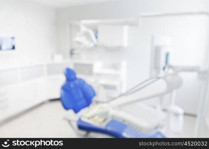 dentistry, medicine and stomatology concept - blurred modern dental clinic office interior bokeh