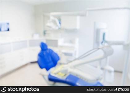 dentistry, medicine and stomatology concept - blurred modern dental clinic office interior bokeh