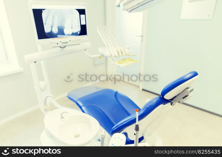 dentistry, medicine, medical equipment and stomatology concept - interior of new modern dental clinic office with chair