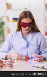 Dentistry student practicing skills in classroom