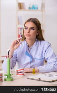 Dentistry student practicing skills in classroom