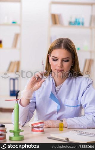 Dentistry student practicing skills in classroom