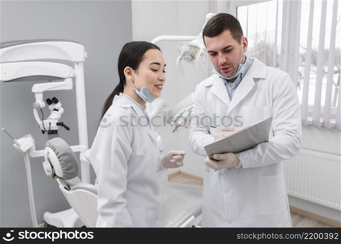 dentists looking clipboard
