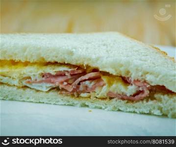 Denver sandwich consists of a Denver omelette - consisting of at least ham, onion, green pepper, and scrambled eggs