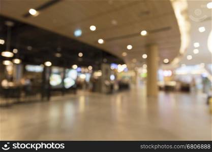 department store center for use as shopping concept, blur background with bokeh light