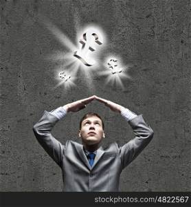 Depressed businessman. Young businessman Holding arms above head. Money concept