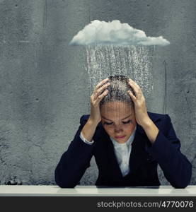 Depressed businesswoman. Young crying businesswoman with hands on head