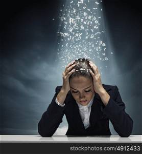 Depressed businesswoman. Young crying businesswoman with hands on head