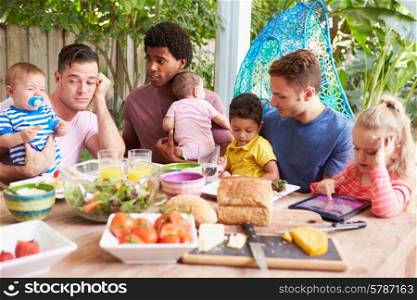 Depressed Father With Baby Talking To Friends