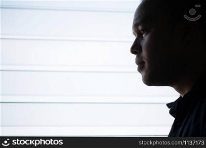 depressed man Absent-minded stand edge the window .dramatic concept