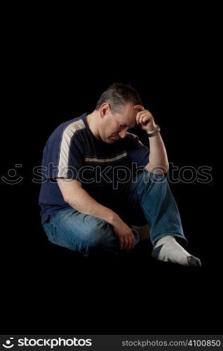Depressed man on black background