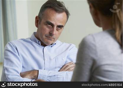 Depressed Mature Man Talking To Counsellor