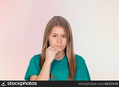 Depressed teen girl thinking isolated on orange background