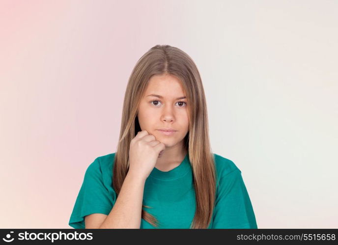 Depressed teen girl thinking isolated on orange background