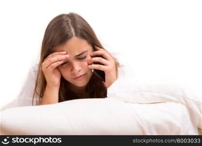 Depressed woman lying in bed, isolated over white