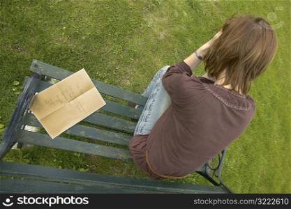 Depressed Woman Sitting on Park Bench