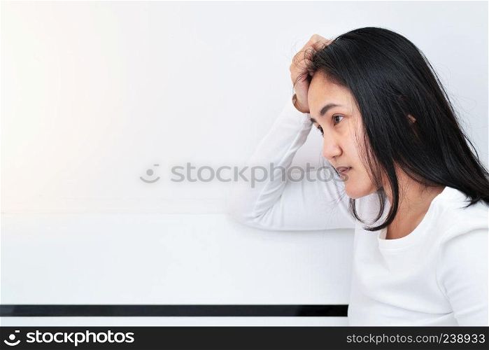 depressed women sitting in the corner of the room, alone, sadness, emotional concept