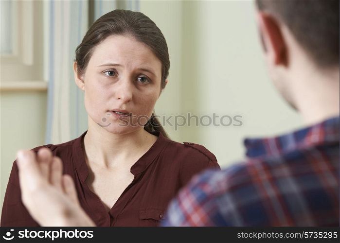 Depressed Young Woman Talking To Counsellor