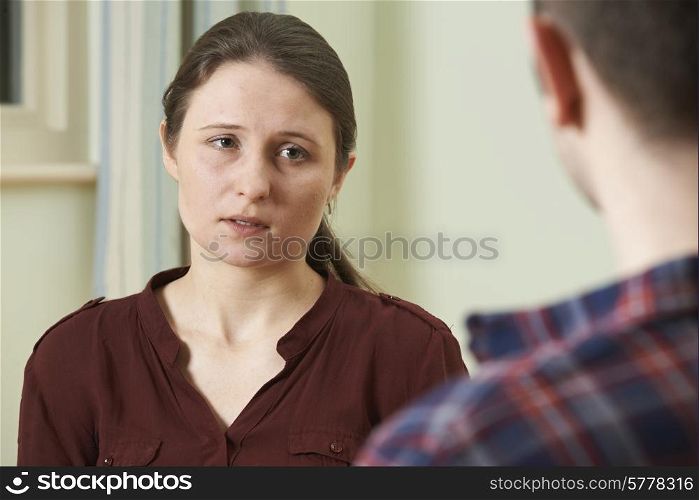 Depressed Young Woman Talking To Counsellor