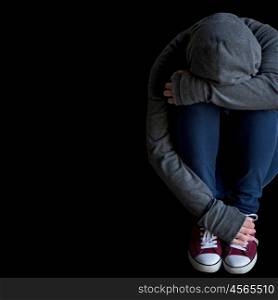 depression, drug addiction, people and social issue concept - close up of person hiding her face over blank black background