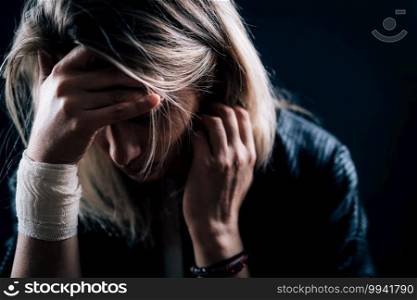 Depression - portrait of a depressed woman, covering face with hands . Depression - Depressed woman, covering face with hands