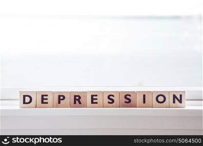 Depression word made om wooden cubes in a bright room