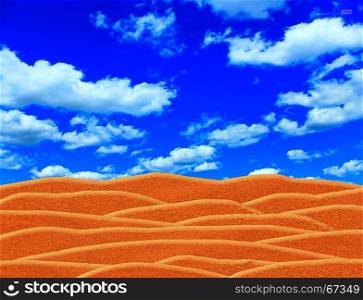 desert and blue sky above it. desert and blue cloudy sky above it