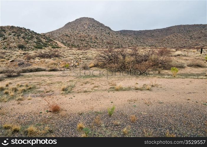 Desert hills and field on a rainy day near Hackberry, Arizona