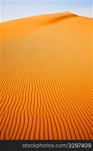 Desert landscape: close view of a sand dune in sahara desert, Africa.