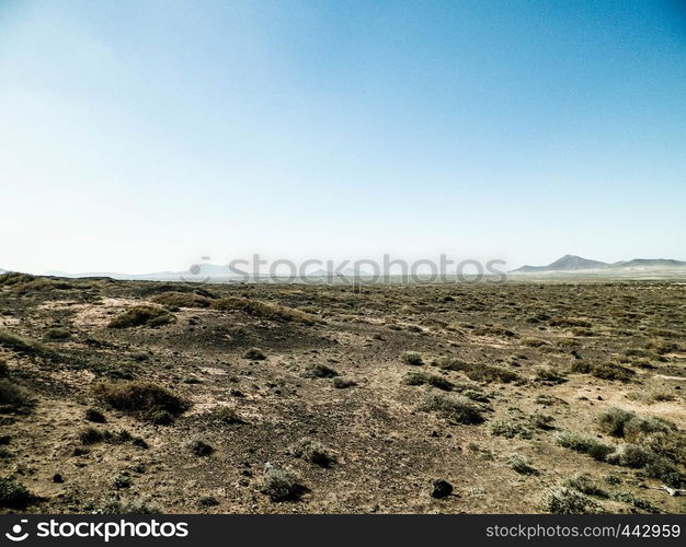 Desert landscape, Lanzarotte , Canary Islands. Desert is typical landscape on Lanzarote island. Travel and nature concept.. Desert landscape, Lanzarotte , Canary Islands.