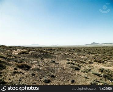 Desert landscape, Lanzarotte , Canary Islands. Desert is typical landscape on Lanzarote island. Travel and nature concept.. Desert landscape, Lanzarotte , Canary Islands.