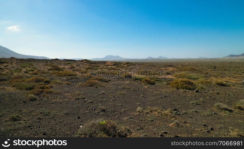 Desert landscape, Lanzarotte , Canary Islands. Desert is typical landscape on Lanzarote island. Travel and nature concept.. Desert landscape, Lanzarotte , Canary Islands.