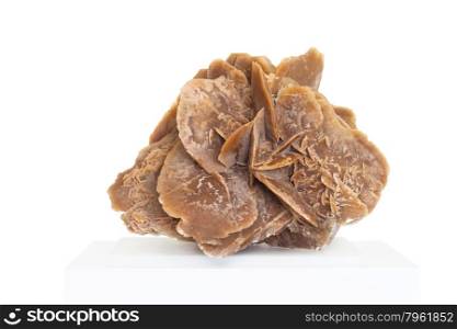 Desert rose,rock composed of gypsum, water and sand, formed in the deserts in very beautiful crystals shape,on white background