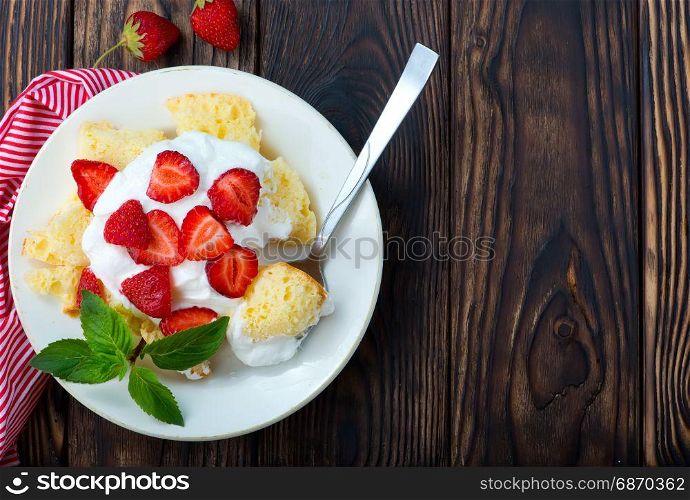 desert with cream and raspberry on the plate