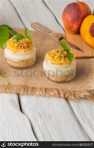 Desert with yogurt and passion fruit top on wooden table.