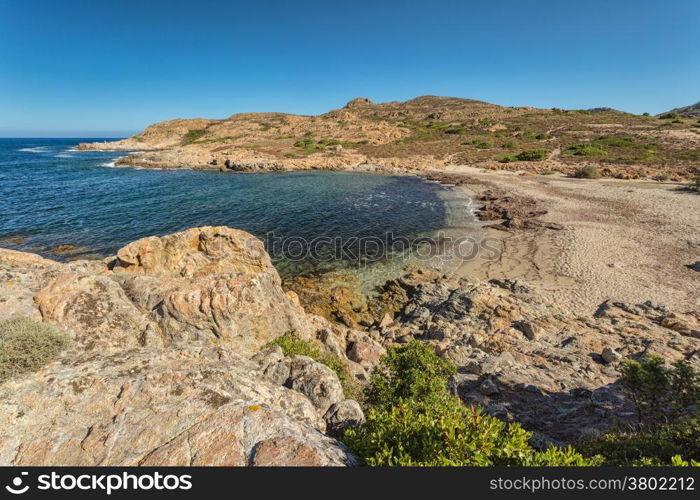 Deserted beach and rocks on the coast of Desert des Agriates near Ostriconi in north Corsica