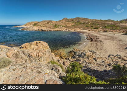 Deserted beach and rocks on the coast of Desert des Agriates near Ostriconi in north Corsica