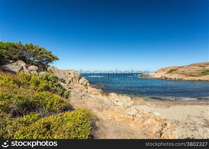 Deserted beach and rocks on the coast of Desert des Agriates near Ostriconi in north Corsica