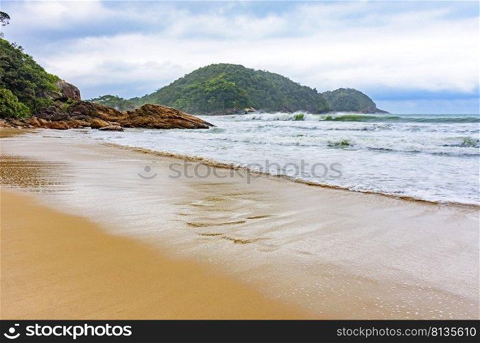 Deserted beach during rainy day with clouds in Trindade, Rio de Janeiro. Deserted beach during rainy day with clouds