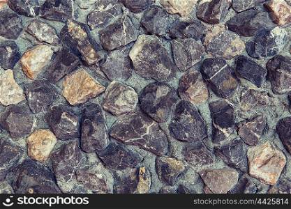 design and texture concept - grainy stone decorative tile background. stone decorative tile texture