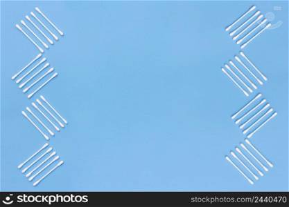 design made with cotton swabs side blue background