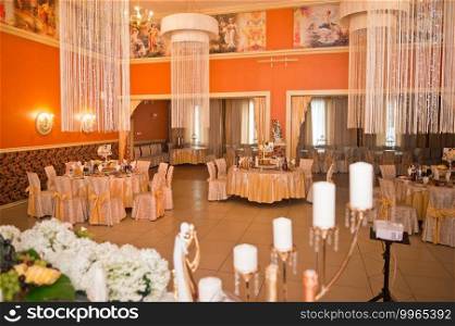 Design of the orange Banquet hall for special occasions.. Festive decoration of the orange Banquet hall for the wedding 2539.