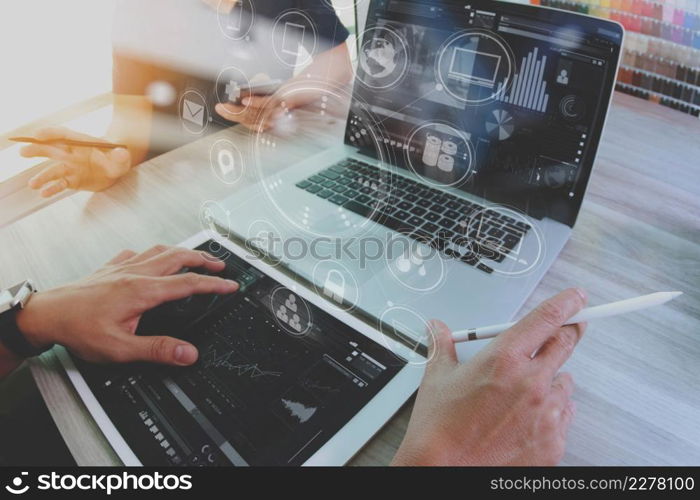Designer and Businessman using smart phone and digital tablet and laptop computer in modern office with virtual screen interface icons diagram as concept