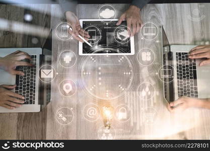 Designer and Businessman using smart phone and digital tablet and laptop computer in modern office with virtual screen interface icons diagram as concept