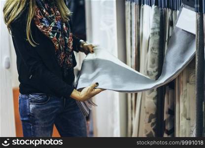 Designer choosing fabric for curtains