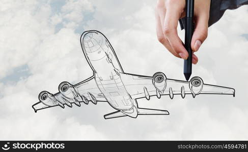 Designer draw airplane . Person drawing airplane model on sky background