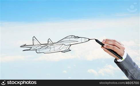 Designer draw airplane. Person drawing airplane model on sky background