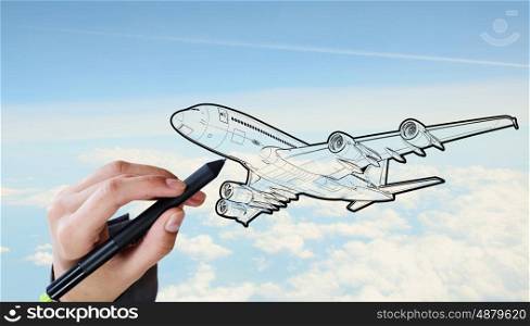 Designer draw airplane . Person drawing airplane model on sky background