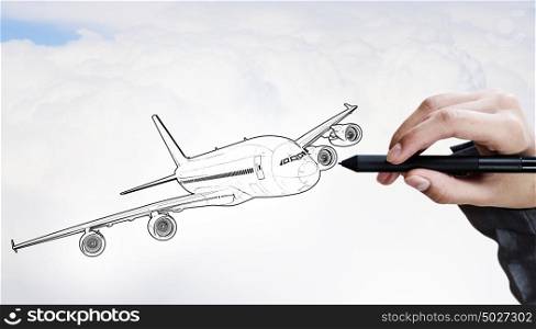 Designer draw airplane . Person drawing airplane model on sky background